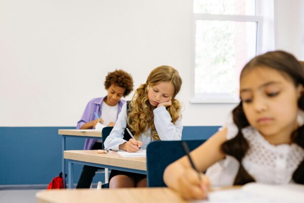 Students in the Classroom Writing by Yan Krukau pexels-yankrukov-8617945