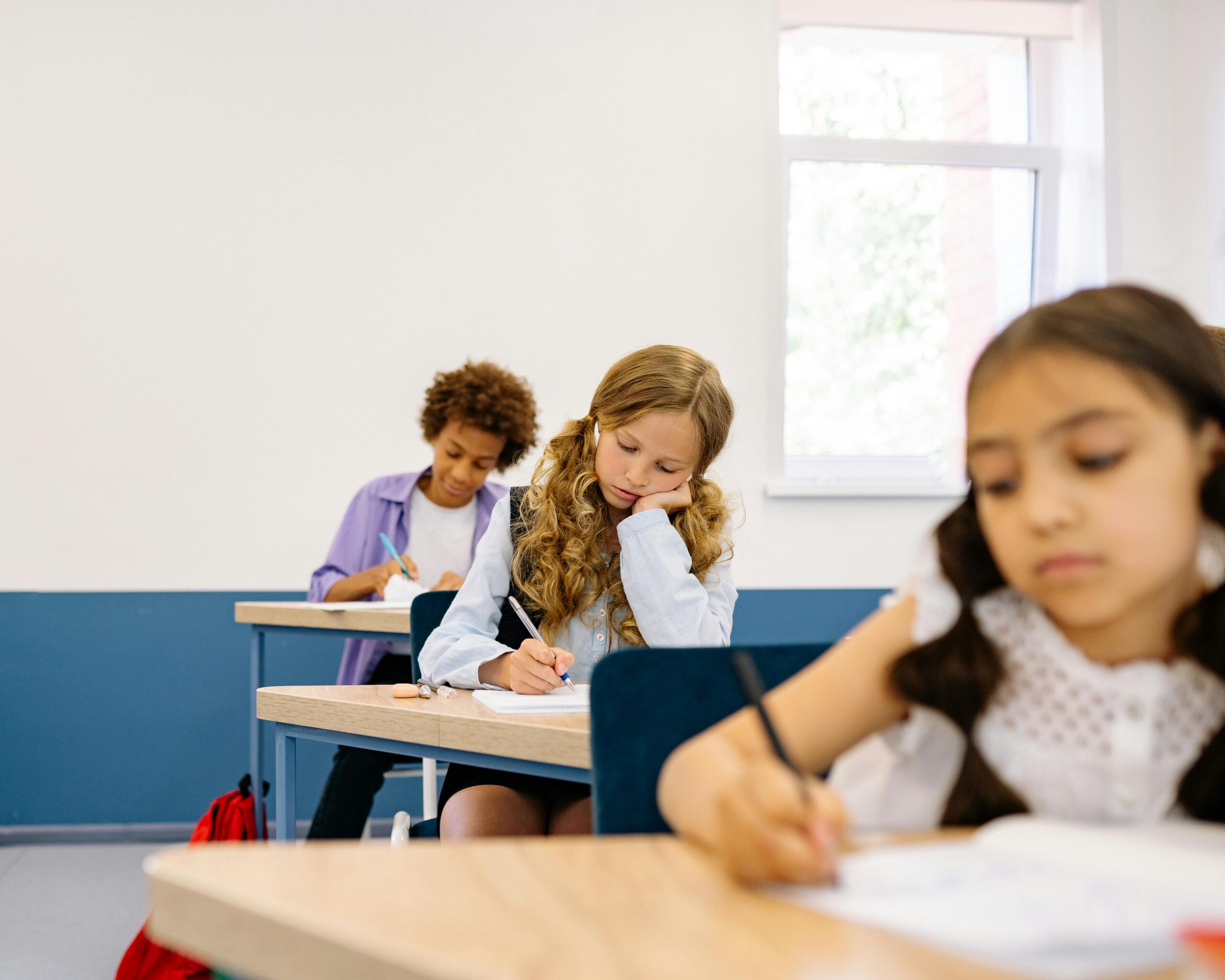 Students in the Classroom Writing by Yan Krukau pexels-yankrukov-8617945